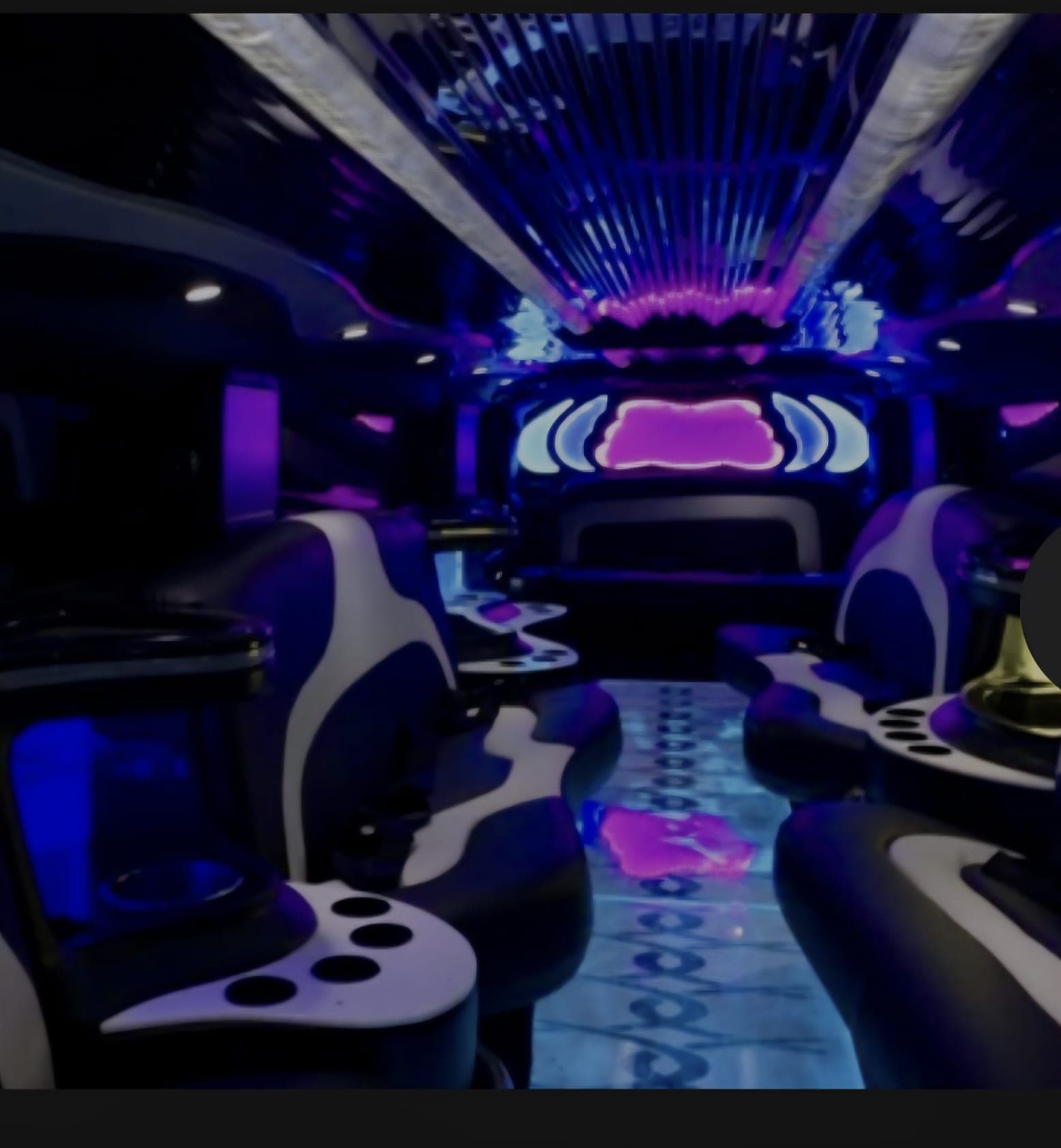 Inside the Studio purple stretch Hummer with neon mood lighting and leather seating